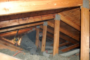 Thermal Craft Insulation Installer at work in attic